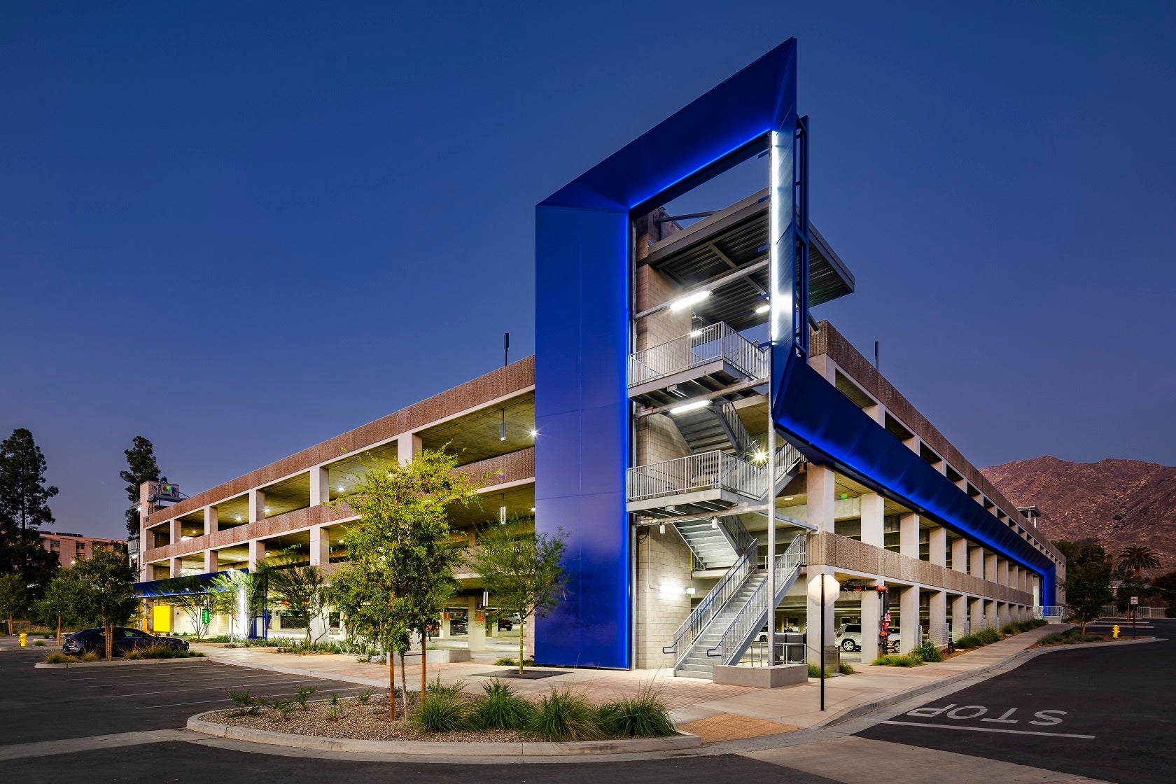 Corner of parking structure with blue colored cement
