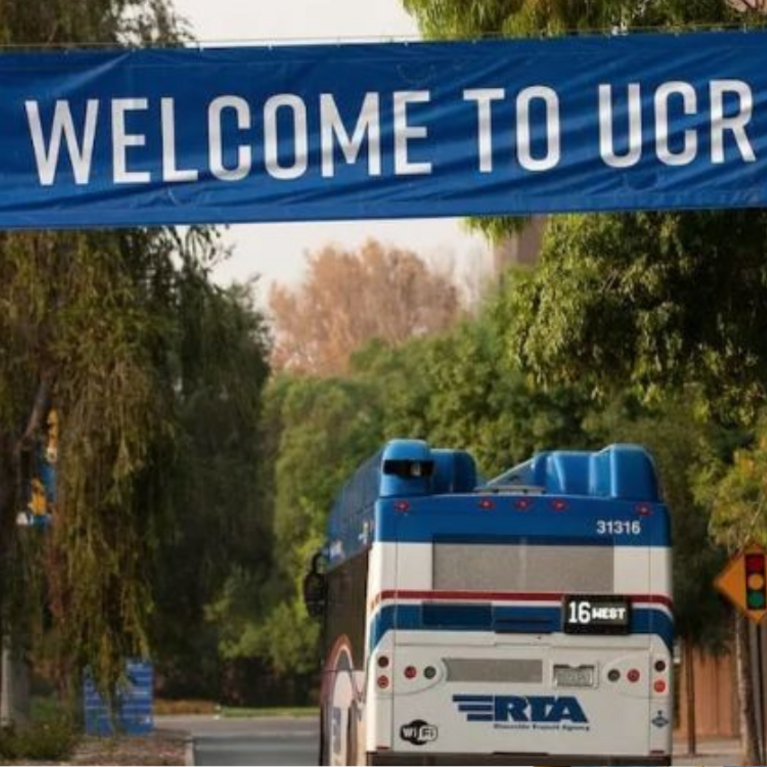 26-27 Web Article Image of RTA Bus with Welcome to UCR Banner